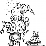 Chłopiec oglądający padający śnieg