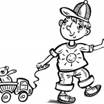 Chłopiec bawiący się ciężarówką...