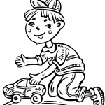 Chłopiec bawiący się samochodzikiem