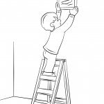 Boy Hanging Picture on a Wall with...