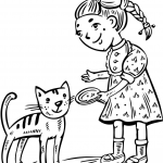 Dziewczynka karmiąca swojego kotka