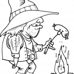 Kowboj grillujący kiełbaskę