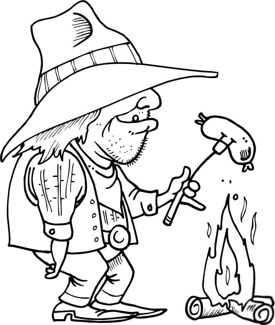 Kowboj grillujący kiełbaskę