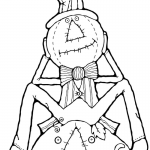 Strach na wróble siedzący na dyni