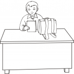 School Boy Sitting at the Desk