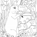 Easter Rabbit is Decorating An Egg